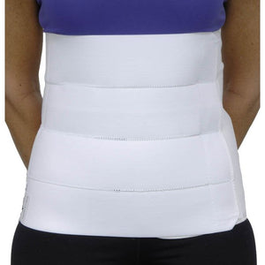 White waist support belt worn by a person with a blue top and black pants. - okotoks hc pharmacy