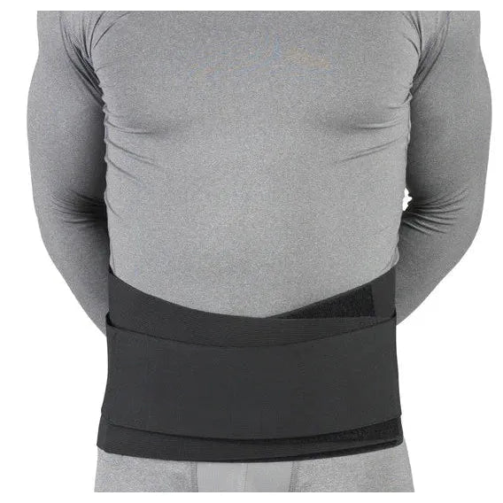 Person wearing a gray long-sleeve shirt and gray shorts with a black compression wrap on a white background - okotoks hc pharmacy
