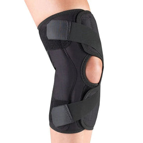 Black knee brace on a person's knee against a white background - Okotoks HC Pharmacy