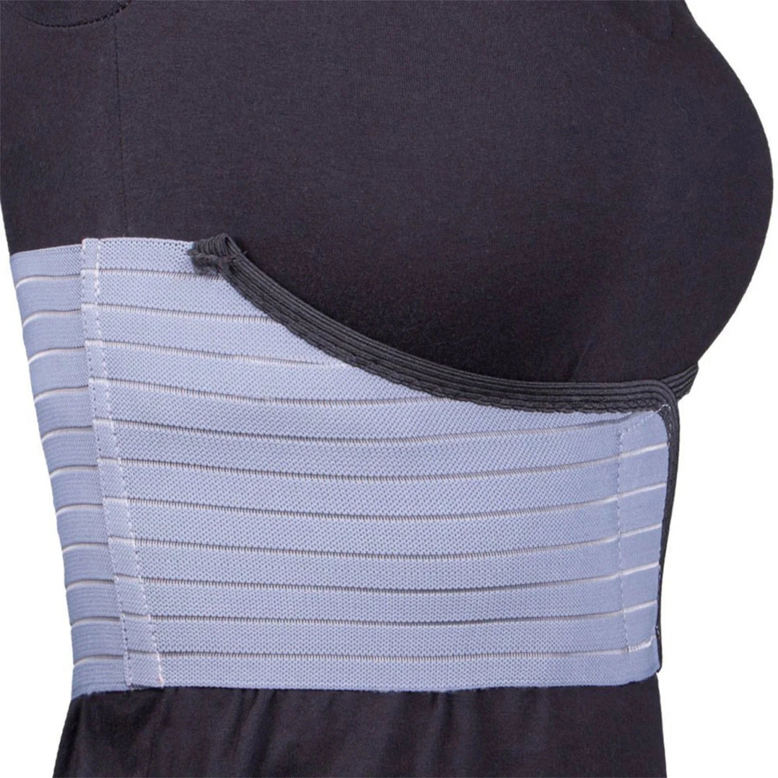 woman wearing a blue abdominal support belt on a white background - okotoks hc pharmacy