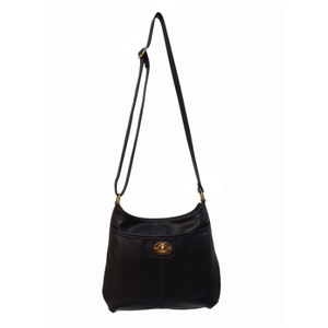 Black shoulder bag with a gold clasp on a white background - okotoks hc pharmacy
