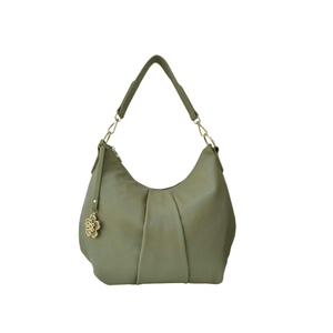 Green handbag with a decorative charm on a white background - okotoks hc pharmacy
