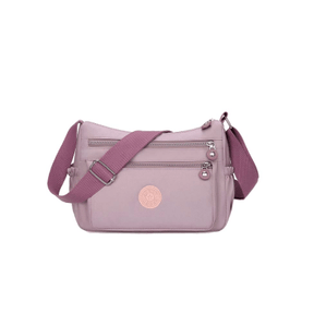 Pink handbag with a visible brand logo on a white background - okotoks hc pharmacy