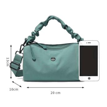 Teal handbag with a black strap on a white background - okotoks hc pharmacy