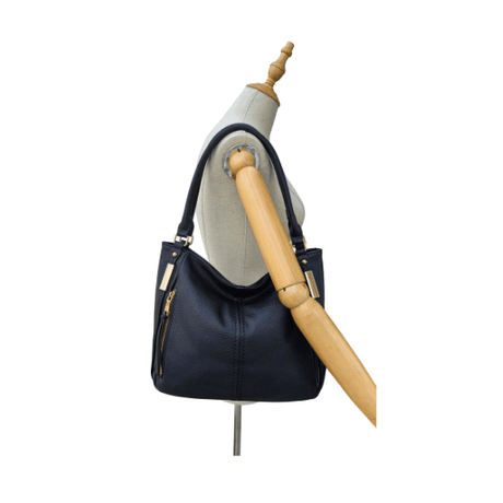 Black handbag on a mannequin with a white background - okotoks hc pharmacy