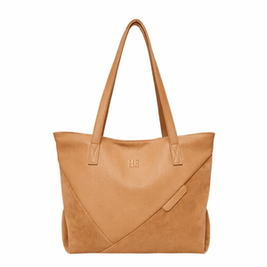 Tan handbag with a visible brand logo on a white background - okotoks hc pharmacy