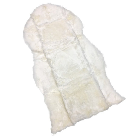 A cream-colored sheepskin or faux fur blanket with a soft, fluffy texture, shown against a plain white background. - okotoks hc pharmacy