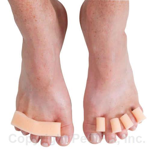 Feet with toe separators on a white background - okotoks hc pharmacy