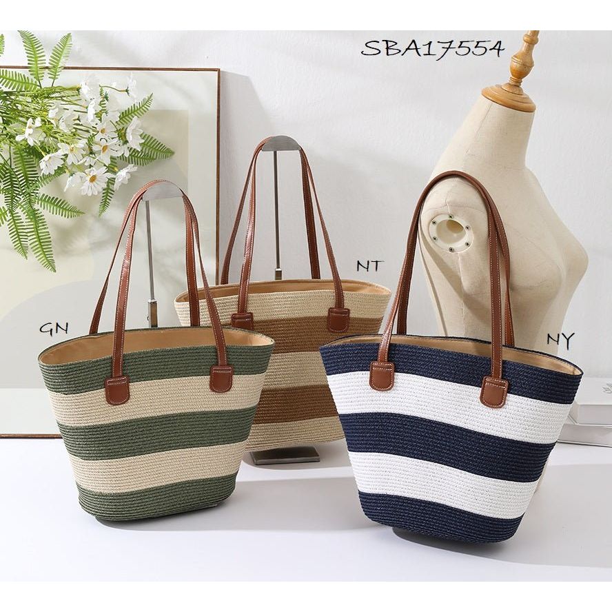 Three striped handbags on a mannequin and surface with a plant in the background. - okotoks hc pharmacy