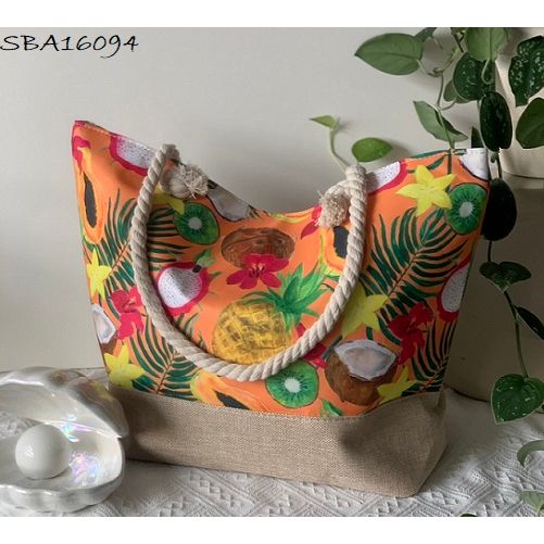 Colorful beach bag with tropical fruit design on a light surface. - okotoks hc pharmacy