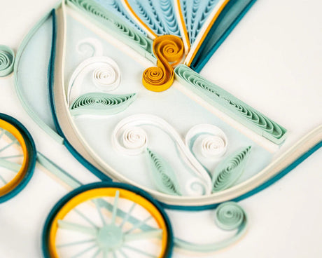 Quilled paper art with intricate patterns and colors on a white background - okotoks hc pharmacy