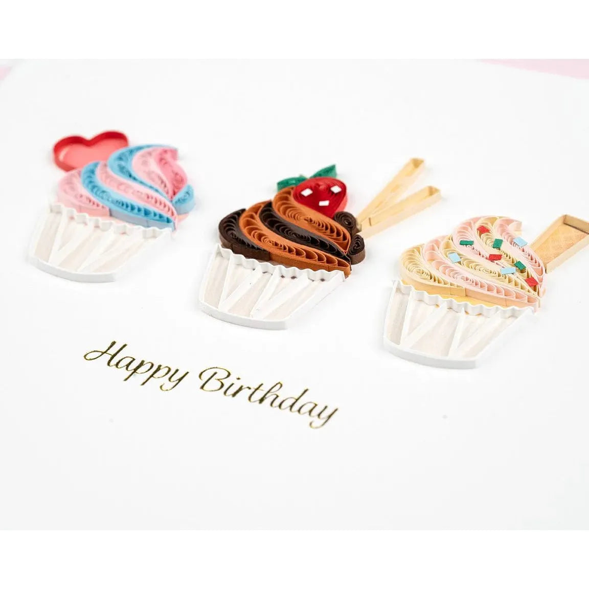 Three colorful cupcake-shaped cookie cutters on a white background with 'Happy Birthday' text. - okotoks hc pharmacy