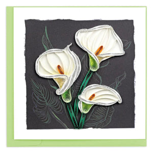 Quilled white lilies on a dark gray background with green accents - okotoks hc pharmacy