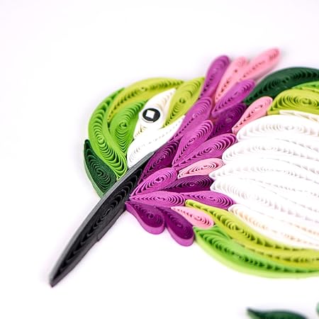 Colorful paper quilling strips with a pair of scissors on a white background - okotoks hc pharmacy