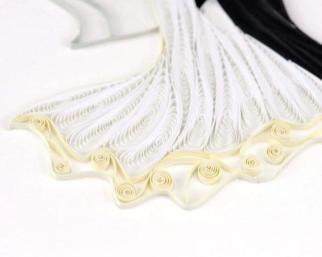 Decorative white ribbon with gold trim on a white background - okotoks hc pharmacy