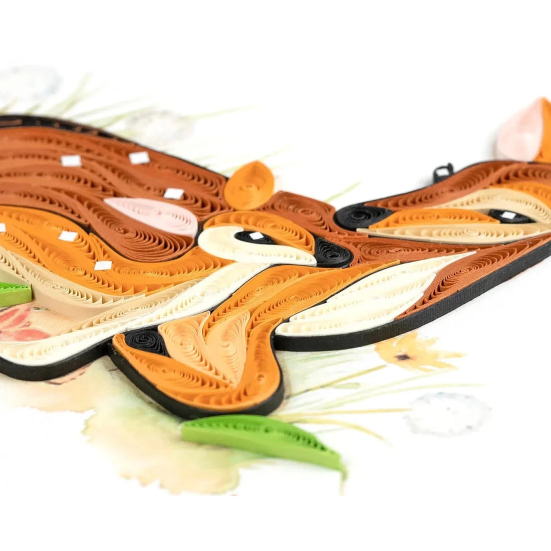 Quilled paper craft of a deer with a white background - okotoks hc pharmacy