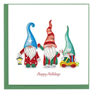 Three colorful gnomes on a 'Happy Holidays' card - okotoks hc pharmacy