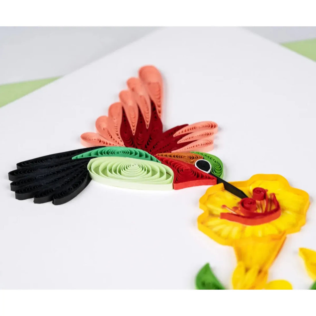 Colorful paper quilling art on a white background - okotoks hc pharmacy
