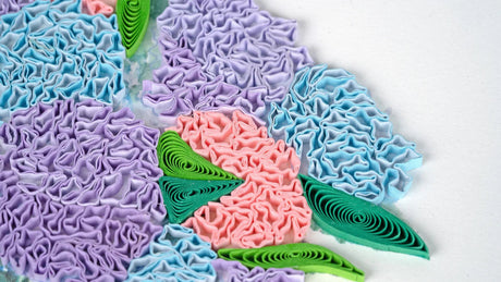 Colorful textured paper flowers on a white background - okotoks hc pharmacy