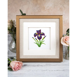 Framed artwork of a purple flower on a wooden surface with pink roses. - okotoks hc pharmacy
