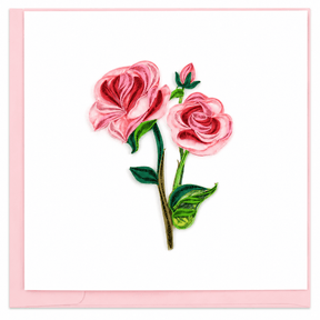 Embroidered design of pink roses on a white background with a pink border. - okotoks hc pharmacy