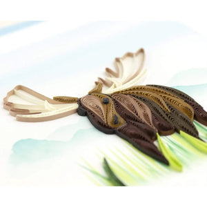 Quilled paper moose on a light background - okotoks hc pharmacy