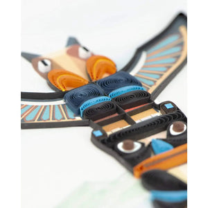 Quilled paper craft of a stylized bird with blue, black, and orange colors on a white background. - okotoks hc pharmacy