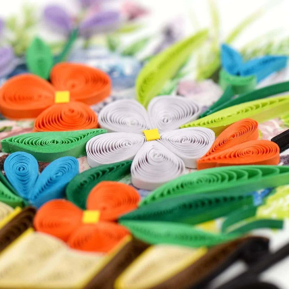 Colorful paper flowers and leaves on a blurred background - okotoks hc pharmacy