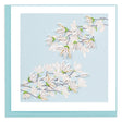 Card with white floral design on a light blue background - okotoks hc pharmacy