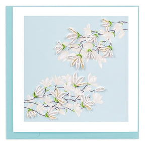 Card with white floral design on a light blue background - okotoks hc pharmacy
