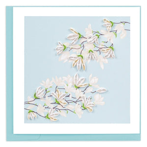 Card with white floral design on a light blue background - okotoks hc pharmacy