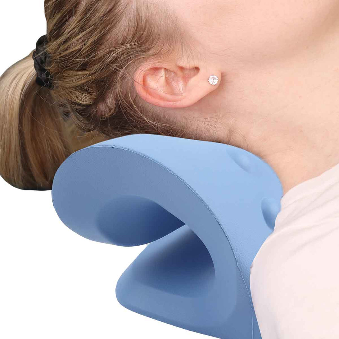 Person using a blue neck pillow for comfort - okotoks hc pharmacy