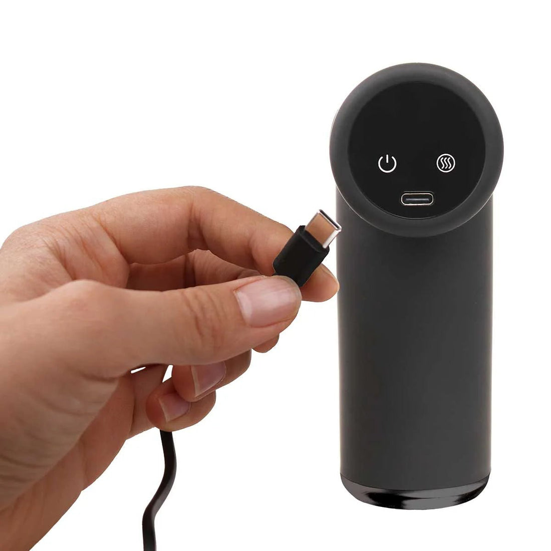 Hand holding a black cylindrical device with USB connector on a white background - okotoks hc pharmacy