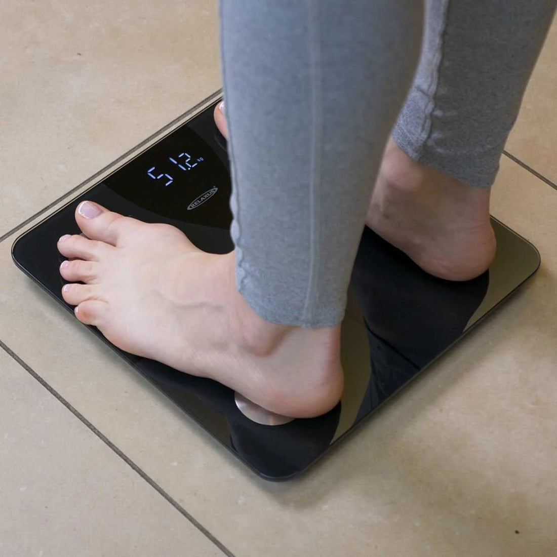 Person standing on a digital scale - okotoks hc pharmacy