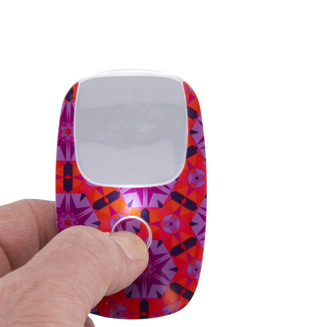 magnifier device held by a hand on a white background - okotoks hc pharmacy