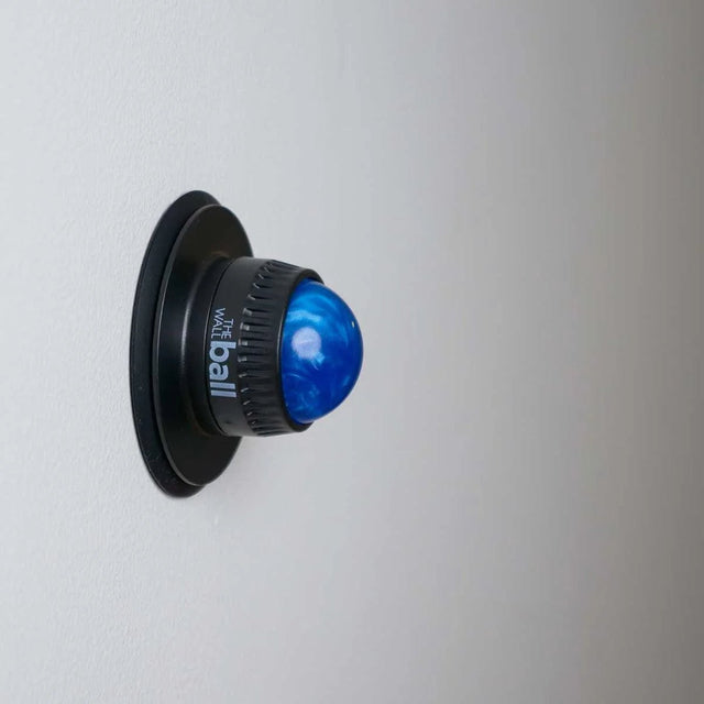 Blue massager on a white wall - okotoks hc pharmacy