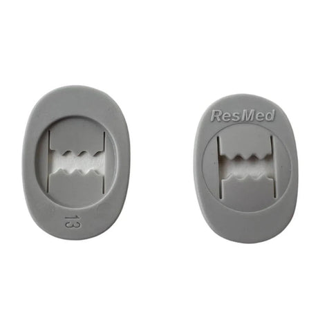 Two gray headgear clips with 'ResMed' branding on a white background. - okotoks hc pharmacy