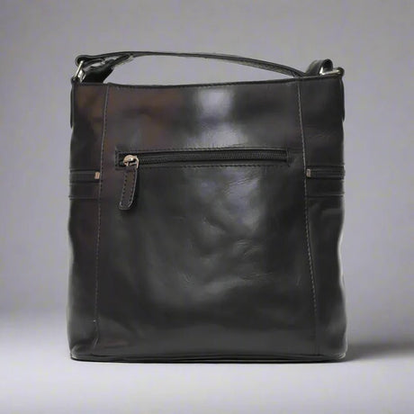Black leather handbag on a gray background - okotoks hc pharmacy