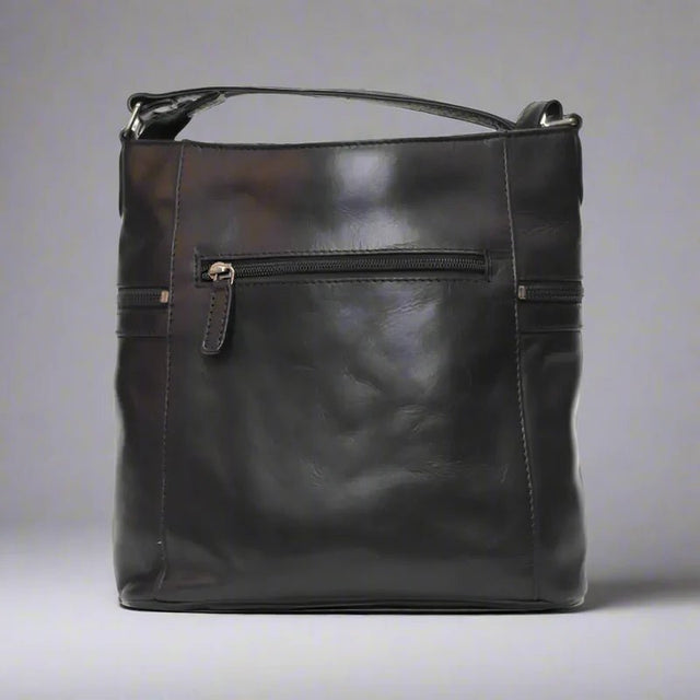 Black leather handbag on a gray background - okotoks hc pharmacy