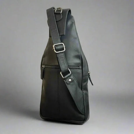 Black leather sling bag on a gray background - okotoks hc pharmacy
