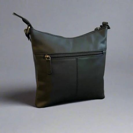 black leather handbag with a zipper on a gray background - okotoks hc pharmacy