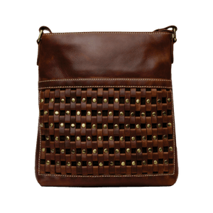 Brown leather crossbody bag with woven pattern and studs on a black background - okotoks hc pharmacy