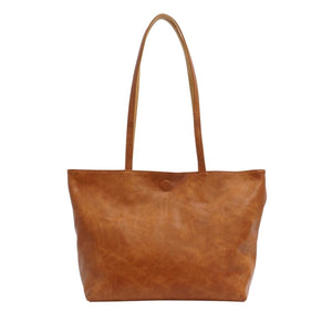 Brown leather tote bag on a white background - okotoks hc pharmacy