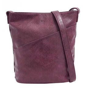 Purple leather bag with a strap on a white background - okotoks hc pharmacy