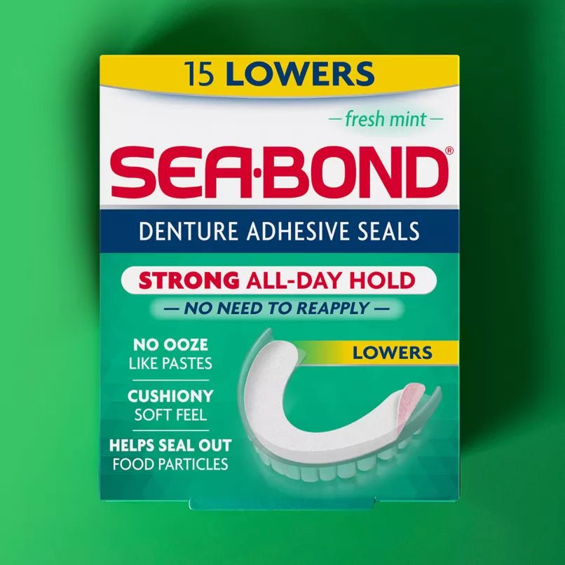 A box of Sea-Bond Denture Adhesive Seals, 15 Lowers, in a fresh mint flavor. The packaging is teal, white, and red, with a graphic of a white denture showing the seal application.- okotoks hc pharmacy