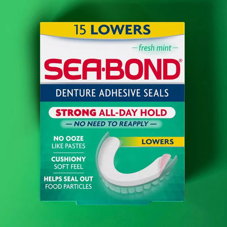 A box of Sea-Bond Denture Adhesive Seals, 15 Lowers, in a fresh mint flavor. The packaging is teal, white, and red, with a graphic of a white denture showing the seal application.- okotoks hc pharmacy