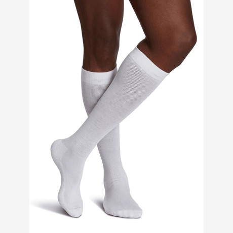 White knee-high socks worn by a person on a white background - okotoks hc pharmacy