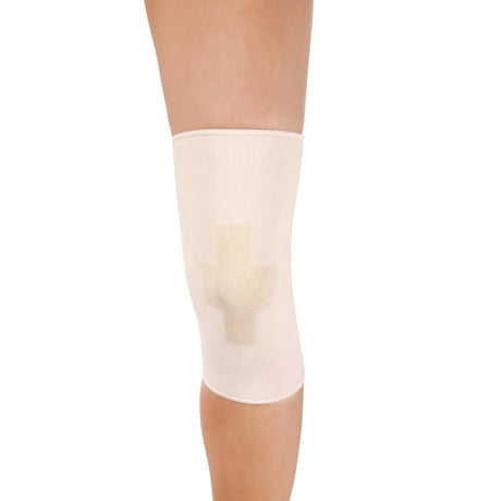 Beige knee support brace on a person's knee against a white background - Okotoks HC Pharmacy