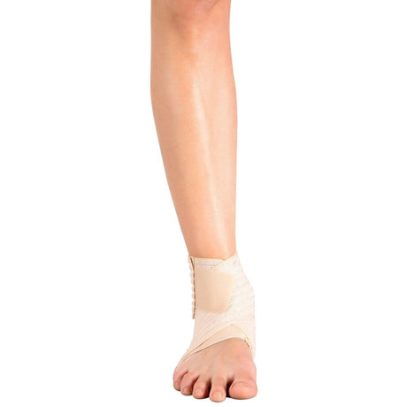 Beige ankle support brace on a person's foot against a white background - Okotoks HC Pharmacy