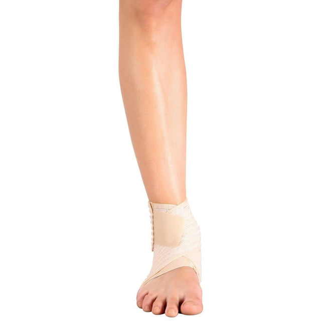 Beige ankle support brace on a person's foot against a white background - Okotoks HC Pharmacy